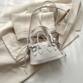 Mini croc-embossed crossbody bag in off-white with top handles and inner pouch - White