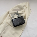 Minimalist black faux-crocodile square bag with silver chain strap on ivory blazer - Black