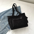 Minimalist black corduroy tote bag with front zipper pocket and side compartments - Black