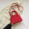 Chic red quilted semi-circular handbag with adjustable strap and twin handles - Red