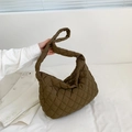 Detailed close-up of dark brown quilted puffer tote bag made of soft nylon fabric - Brown
