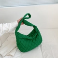 Detail view of vibrant green quilted nylon tote bag with unique knotted handle design - Green