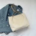 Chic beige textured fabric tote bag with brown leather handles on denim jacket - Off White