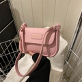 Pink crossbody bag with quilted rhombic texture and metal basket lifestyle display - Pink Without Pendant