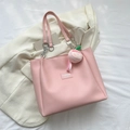 Pink tote bag with silver chain straps and a cute peach plush charm in a flat lay view - With Pendant / Pink