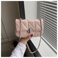 Detailed view of light pink quilted leather bag with silver chain strap and twist lock - Pink