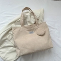 Beige corduroy tote bag with mini pouch and Fashion Instinct tag on a blazer - Khaki