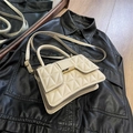 Elegant white quilted crossbody bag with gold metallic clasp and top handle for women - Off White