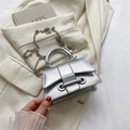 Mini silver metallic chain bag for women with trapezoid shape and stylish crossbody strap - Silver