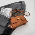 Caramel brown quilted crossbody bag with geometric texture and gold metal buckle detail - Brown