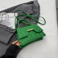 Vibrant green quilted handbag with gold metal clasp and slim shoulder strap - Green
