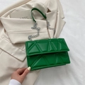 Green quilted crossbody bag with geometric triangle stitching and silver chain strap - Green