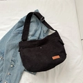 Large black corduroy messenger bag with adjustable strap and leather patch detail - Black