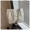 Detailed view of white bubble texture tote bag with elegant pearl and metal flower chains - White