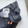 Minimalist black half-moon shoulder bag with golden metal buckle and smooth matte leather - Black
