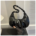 Detail of black pleated hobo bag with braided handle and cloud-like leather texture - Black