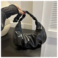 Detail showing the ruched faux leather texture and thick twisted woven handle of the hobo bag - Black
