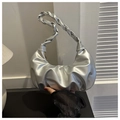 Close-up of a silver pleated crescent bag with a thick woven handle for women - Silver