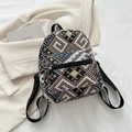 Ethnic style woven mini backpack with colorful geometric patterns and black straps - Black