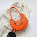 Bright orange crescent shoulder bag with crocodile texture and gold chain detail - Orange