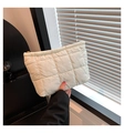 Close-up of off-white quilted clutch bag with golden zipper and rhombus pattern - White