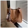 Brown faux leather tote bag with woven straps and decorative geometric printed scarf detail - Brown
