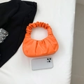 Chic orange pleated hobo bag with scrunched top handle for trendy women outfits - Orange