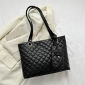 Elegant black quilted tote bag with matching small coin purse and gold hardware - Black
