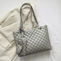 Silver quilted tote bag with matching mini pouch and chain detail on modern textured fabric - Silver