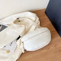 Minimalist white crescent chest bag with woven zipper pull and adjustable beige strap - Off White