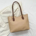 Minimalist beige tote bag with dark brown straps shown on a white knitted background - 37*25.5*13 / Khaki