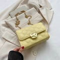 Chic cream yellow crossbody bag with embossed texture and gold chain strap - Yellow