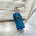 Mini cylindrical glitter bag in blue with golden hardware and metal hook for lipsticks - Blue