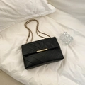 Women's black quilted shoulder bag with gold metal clasp and chain strap detail - Black