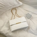 White quilted faux leather crossbody bag with V-shaped stitching and golden chain strap - White