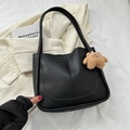 Chic black matte PU tote bag with a brown plush bear charm and sleek curved design - With Pendant / Black