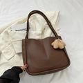 Dark brown faux leather tote bag with curved stitching and cute plush doll pendant - With Pendant / Brown