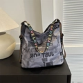 Hobo canvas shoulder bag with newspaper print and colorful LOVE embroidered strap - Gray