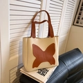 Borsa tote minimalista in pelle beige con patchwork a farfalla marrone e due manici - Cachi