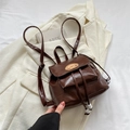 Retro dark brown mini backpack with dog embroidery and glossy finish on light blazer - With Pendant / Brown