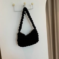 Minimalist black bubble knit hobo bag featuring popcorn texture and shoulder strap - Black