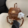 Brown vintage style leather backpack featuring a cartoon patch and star plush pendant - With Pendant / Brown