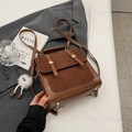 Vintage brown leather crossbody backpack featuring matte texture panels and a fur charm - With Pendant / Brown
