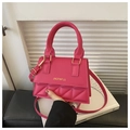 Detail of rose pink PU leather handbag with diamond quilted flap and gold hardware - Rose Red