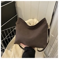 Detail of coffee brown matte suede tote bag featuring smooth stitching and metal buckles - Coffee