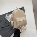 Mini zaino beige in nylon da donna con porta monete e ciondolo a forma di mostro - Bianco Riso (Senza Ciondolo)