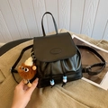 Black PU leather drawstring backpack with fashion embossing and brown plush lion charm - With Pendant / Black
