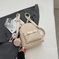 Mini beige minimalist backpack with bow detail, round coin purse and plush monster charm - Cream White with Pendant