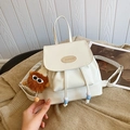 Chic beige mini PU leather backpack featuring a cute brown plush charm and drawstring - With Pendant / Off White