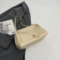 Elegant beige leather shoulder bag with golden chain strap and metallic clasp closure - Off White